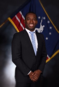 Man standing in front of a flag for the City of Richmond