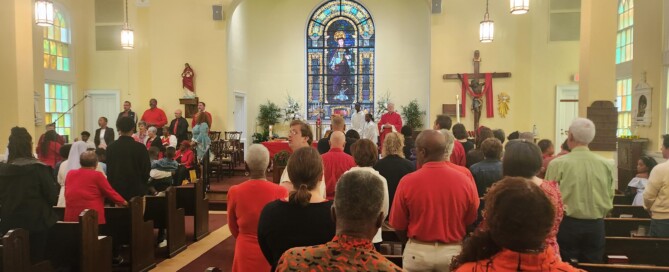 Parishioners wearing red for Pentecost Sunday
